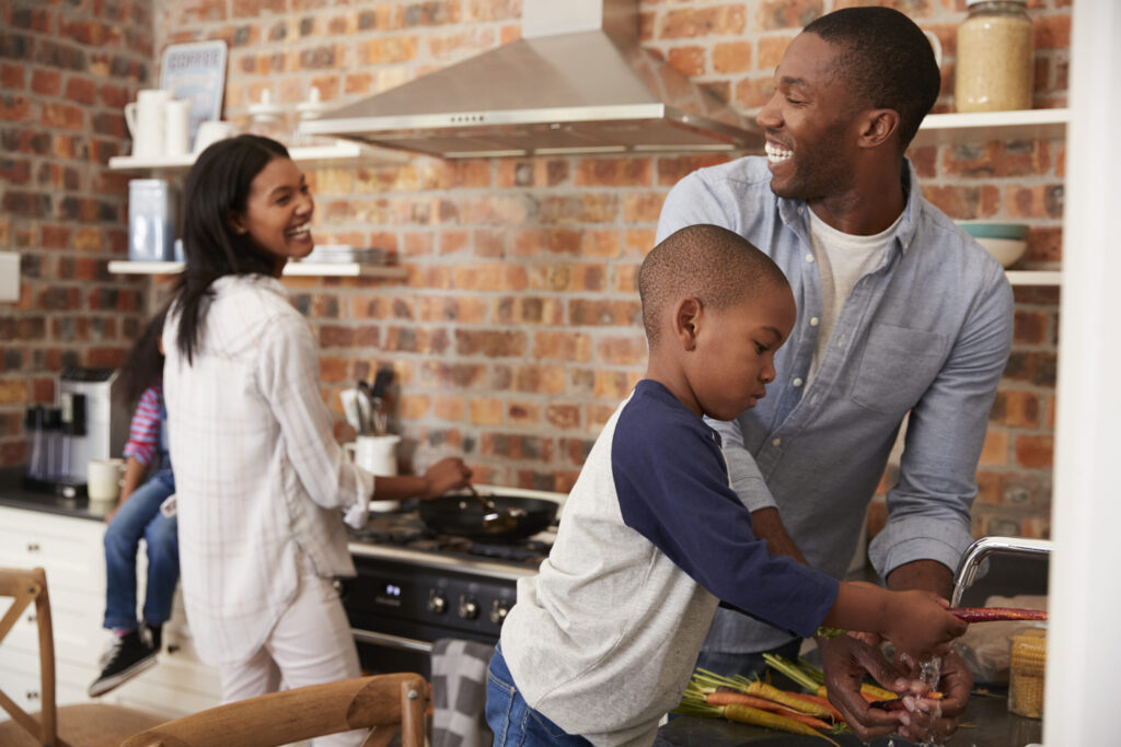 happy family working in the kitchen of their Chicago, IL home